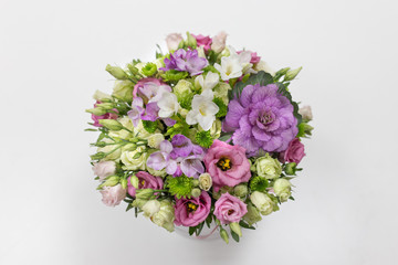 Obraz na płótnie Canvas Wonderful flower arrangement (white, lilac, pink, light green color) in a white hat box on a light background