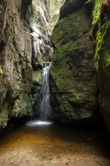Fototapeta na wymiar Waterfall in Rock Town, Adrspach, Teplice, Czech Republic