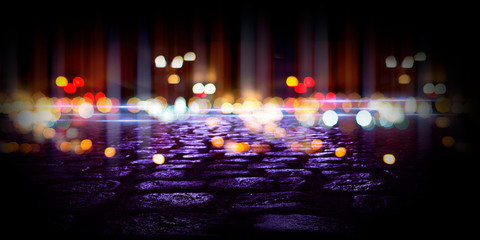 Obraz premium Wet asphalt, reflection of neon lights, a searchlight, smoke. Abstract street with smoke, smog. Night background, night city Abstract bokeh light, night bokeh.