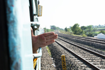 Indian Boy taking hand Outside the Train Window