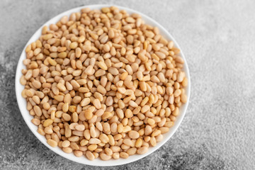 Pine nuts close up. Breakfast, healthy food. It can be used as a background