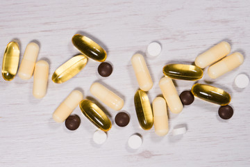 Pills capsules and tablets medicine drugs on the table
