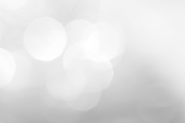 A brilliant white background with circles and ovals. Template for a holiday card with bright and sparkling lights.