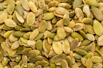 Pumpkin seeds close up. Breakfast, healthy food. It can be used as a background