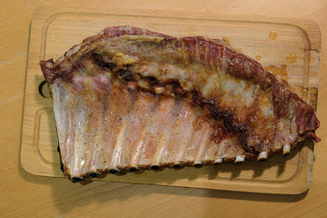 Baked pork ribs on cutting board
