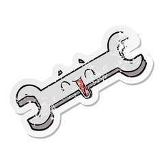 distressed sticker of a cartoon laughing spanner