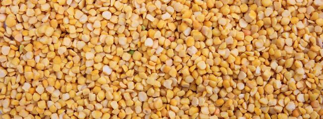 Split peas. Yellow orange color split peeled peas uncooked full background, banner