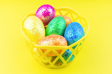 Easter eggs on yellow background