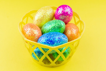 Easter eggs on yellow background