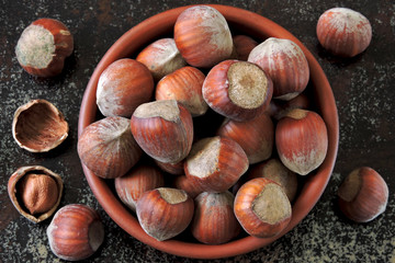 Hazelnuts in a bowl. Fresh hazelnuts in the shell.