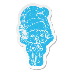 disgusted cartoon distressed sticker of a alien wearing santa hat