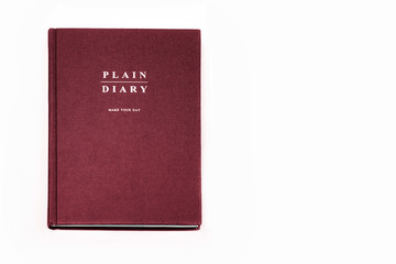 red daily planner on white background