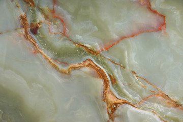 The surface of green onyx with red veins