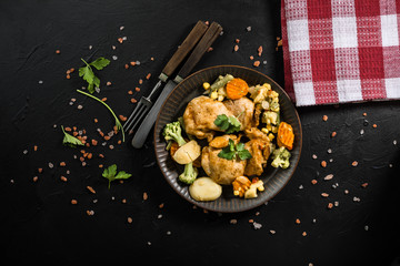 Fried chicken fillet with vegetables.