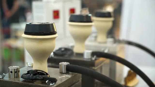 People choosing hookah. Smoking tobacco at exhibition. Shisha bowl at event