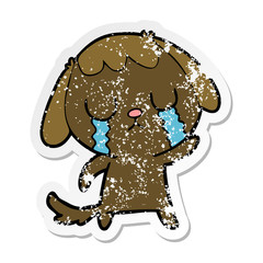 distressed sticker of a cute cartoon dog crying