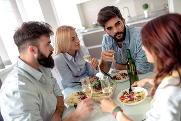 Friends having lunch together at home