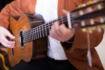 Fototapeta premium Male musician performing on guitar