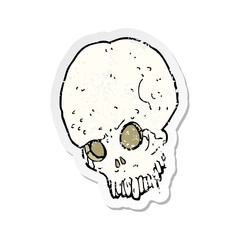 retro distressed sticker of a cartoon spooky skull