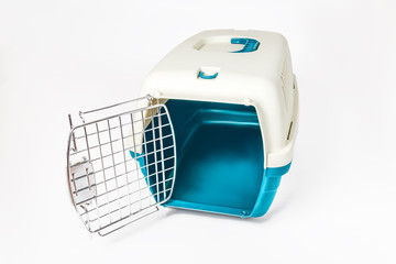 Plastic cage carrying for dogs and cats isolated on white. Travel transportation, veterinary clinic and pet care concept