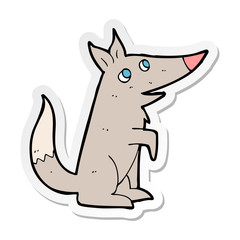 sticker of a cartoon wolf cub