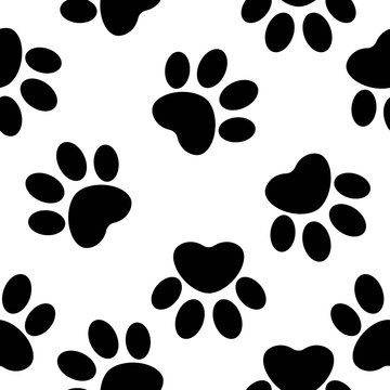 Seamless pattern of black puppy paws