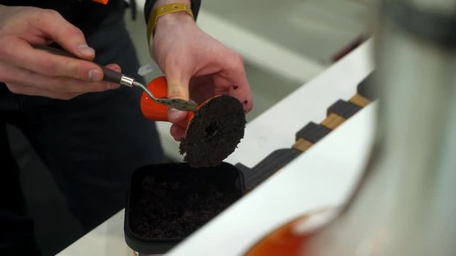Hookah master man preparing shisha bowl for smoking