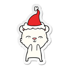 happy sticker cartoon of a polar bear wearing santa hat