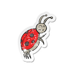 retro distressed sticker of a cartoon ladybug