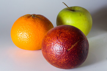 Citrus fruits and green apple on a white background.Isolated.