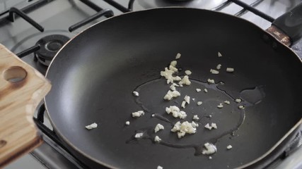 Cooking at home with casserole, garlic and olive oil