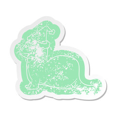 laughing otter cartoon distressed sticker of a wearing santa hat