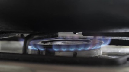 Closed shot of kitchen burners, fire