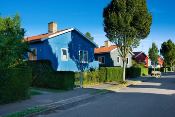 Traditional colorful wooden Swedish houses in the suburbs of Ronne, Bornholm, Denmark. The houses...