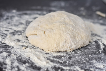dough on a black table, homemade food