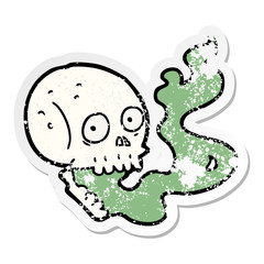 distressed sticker of a cartoon haunted skull