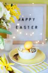 Easter celebration card close up with colored eggs in the bowl 
