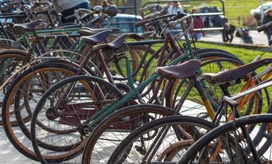 obsolete old-fashioned bikes stand in a row