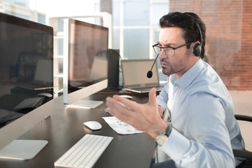 businessman analyzes the data sitting in the office