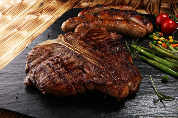 Assorted delicious grilled meat with vegetable on a barbecue with steak