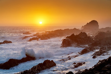 Sunset at rocky coast