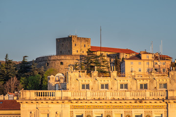 Obraz premium Castle Castello di San Giusto in Trieste on spring sunset