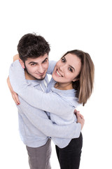 Couple in blue hugging isolated on white