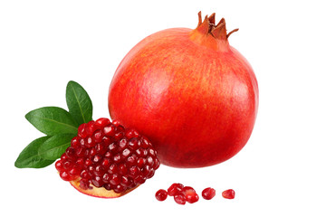 pomegranate fruit with seeds and green leaves isolated on white background