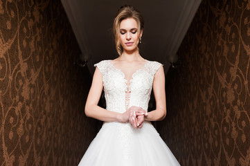 Morning of the bride when she wears a beautiful dress, woman getting ready before wedding ceremony 