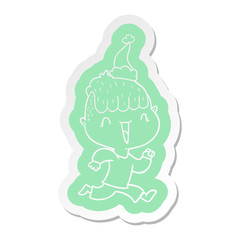 cartoon  sticker of a happy boy surprised wearing santa hat