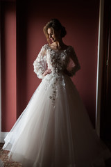 Morning of the bride when she wears a beautiful dress, woman getting ready before wedding ceremony 