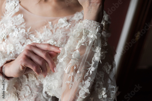 Morning of the bride when she wears a beautiful dress, woman getting ready before wedding ceremony 