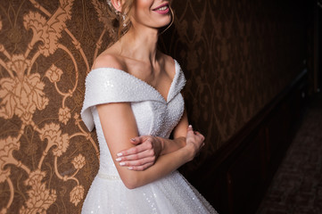 Bride.Young fashion model with perfect skin and make up  brown background  curly hair