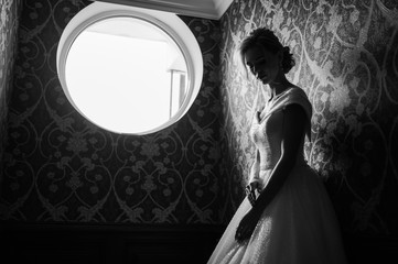 Bride.Young fashion model with perfect skin and make up  brown background  curly hair